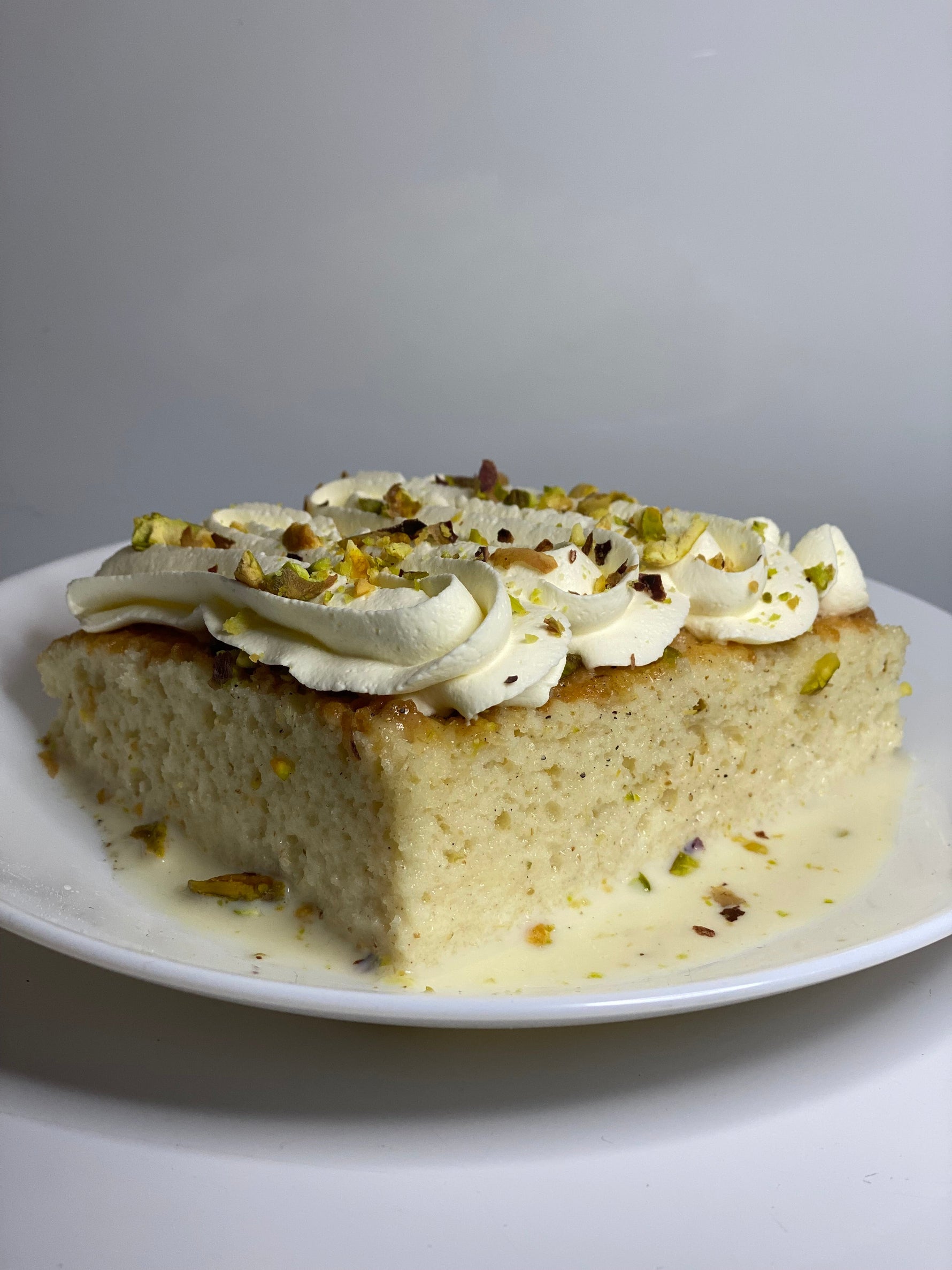 Pistachio Malai Milk Cake Tray topped with handcrafted malai cream and crushed pistachios